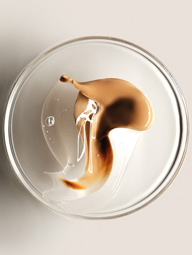 Close up of Pigment Flex Technology swatches in petri dish on a light background with bright lighting